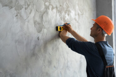 attaching foam board to concrete walls